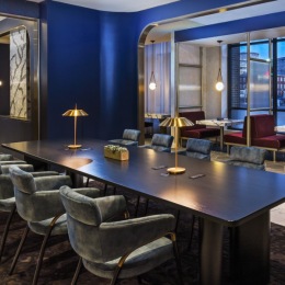 large table with chairs in dark room