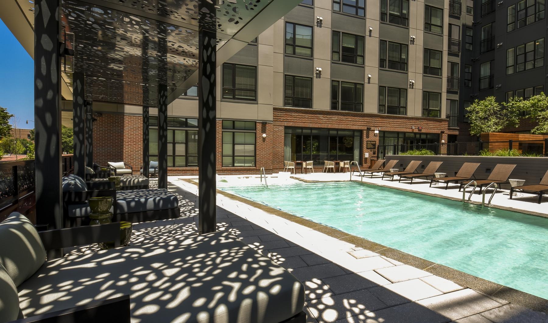 a pool with chairs around it