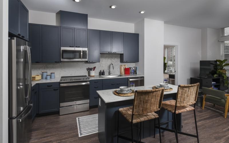 a kitchen with a table and chairs