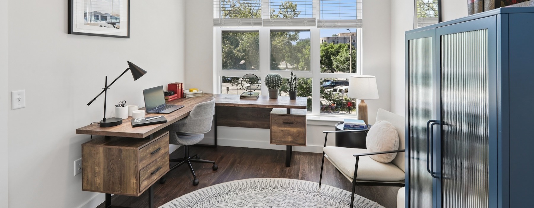 an office with a desk and chairs
