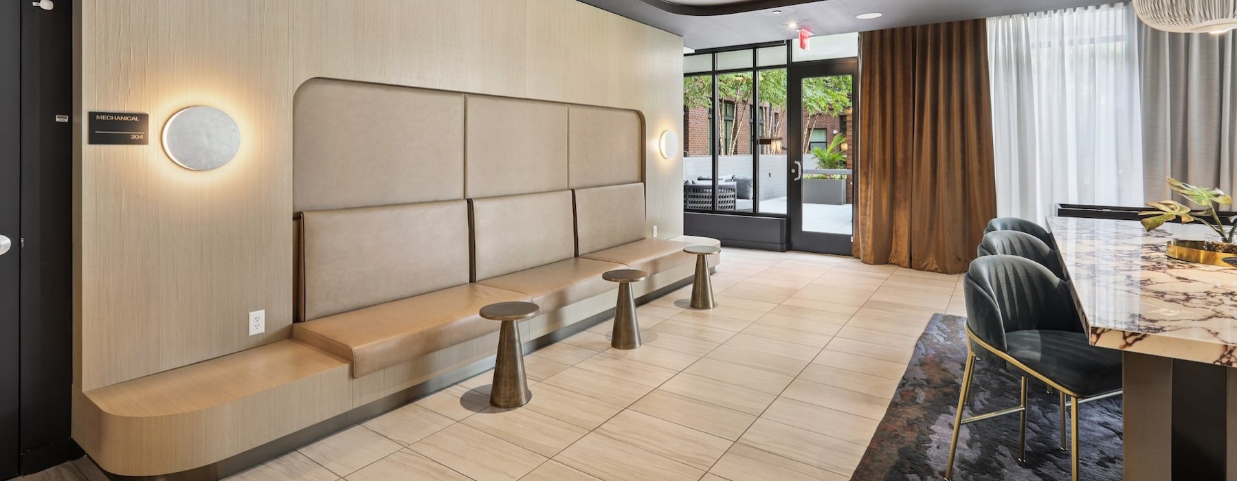 a clubroom with chairs and tables