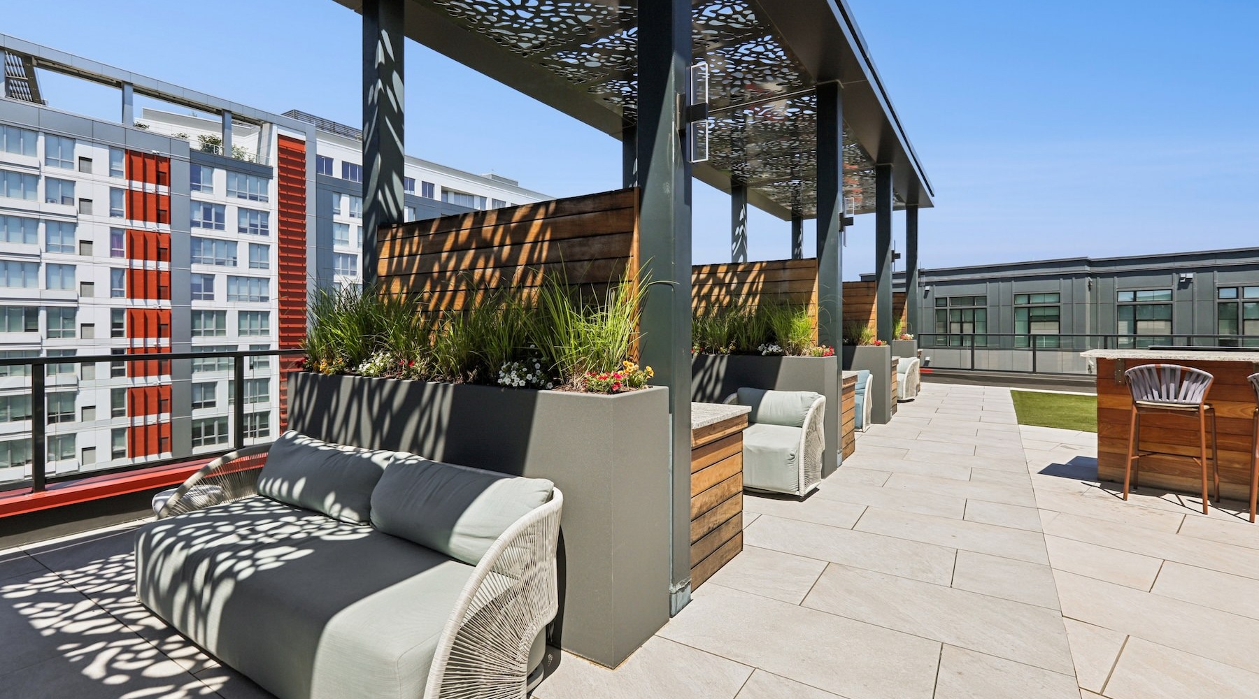 a covered patio with couches