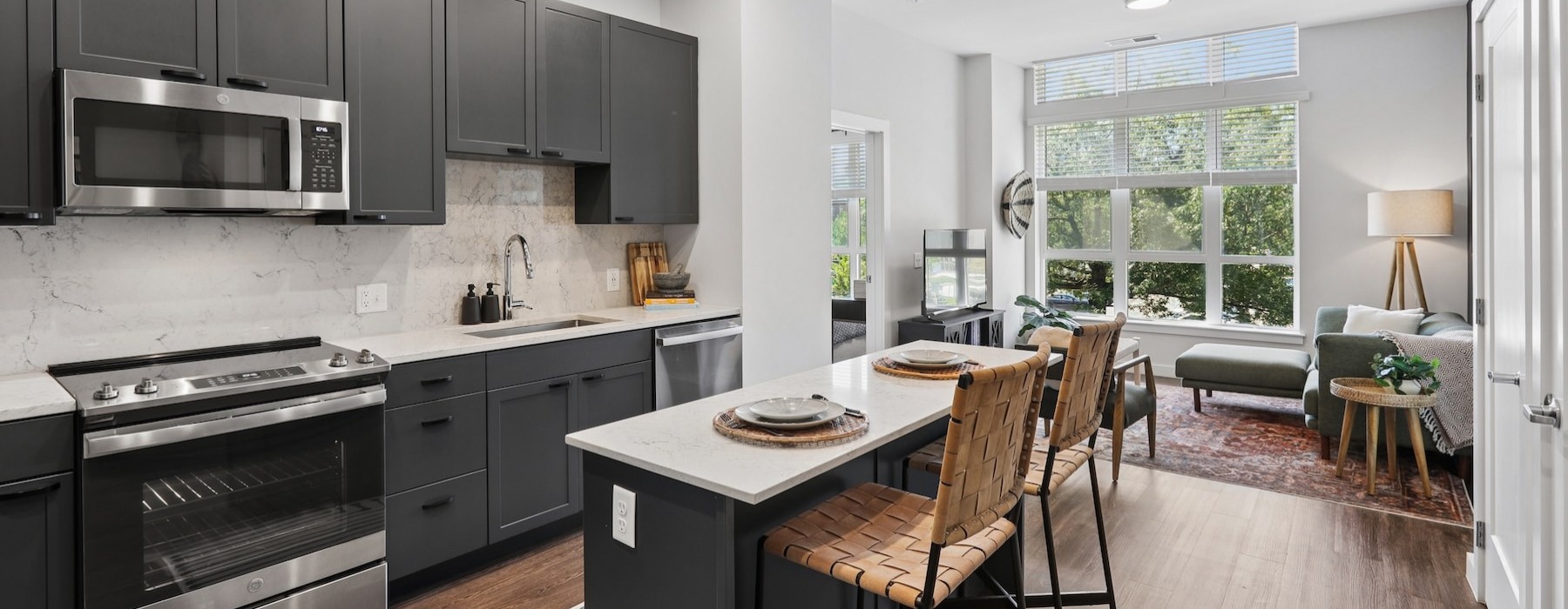 a kitchen with an island and chairs