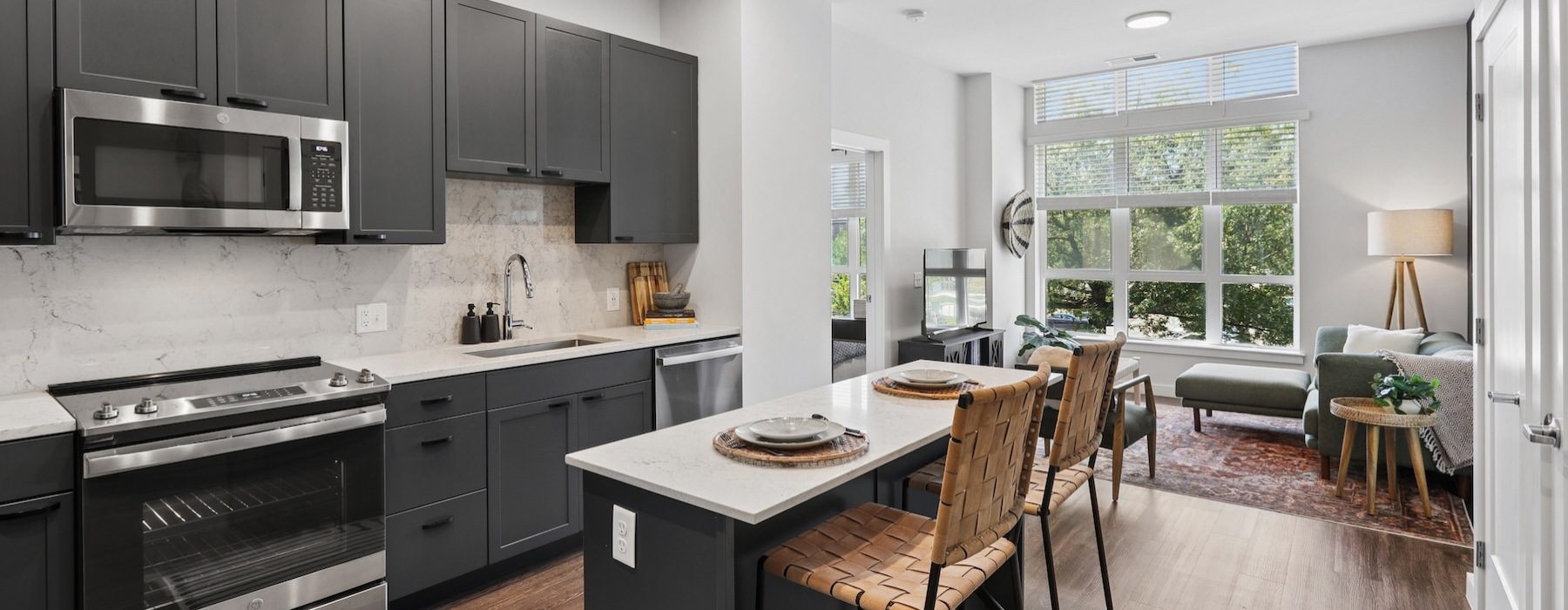 a kitchen with an island and chairs