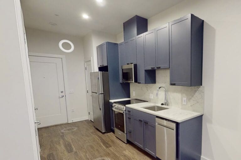 Kitchen with stainless steel appliances at our modern apartments in Capitol Hill